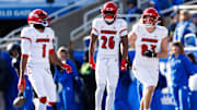 Nov 30, 2024; Lexington, Kentucky, USA; Louisville Cardinals running back Duke Watson (26) celebrates a touchdown with wide receiver Ja'Corey Brooks (1) and  tight end Mark Redman (83) during the second quarter against the Kentucky Wildcats at Kroger Field. Mandatory Credit: Jordan Prather-Imagn Images