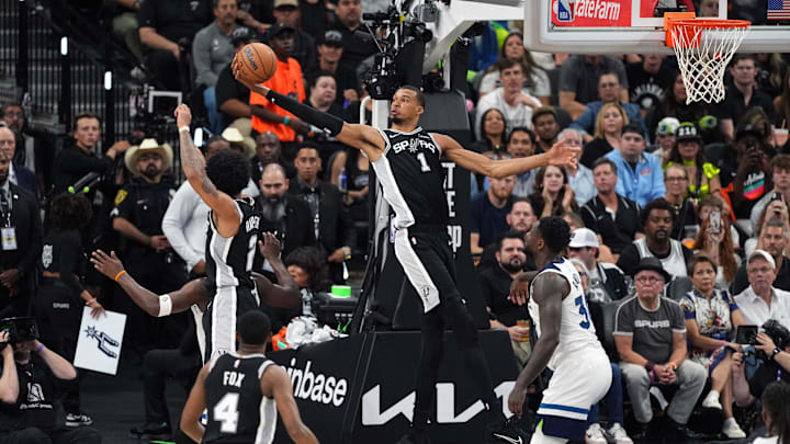 May 12, 2026; San Antonio, Texas, USA; San Antonio Spurs forward Victor Wembanyama (1) reaches for a rebound over Minnesota Timberwolves forward Julius Randle (30) during the second half of game five of the second round of the 2026 NBA Playoffs at Frost Bank Center. Mandatory Credit: Scott Wachter-Imagn Images
