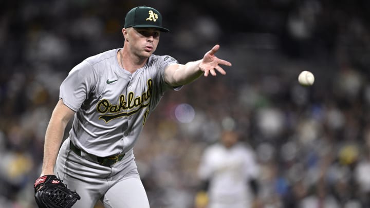 Jun 10, 2024; San Diego, California, USA; Oakland Athletics relief pitcher Sean Newcomb (16) tosses the ball to first base during the sixth inning against the San Diego Padres at Petco Park. Mandatory Credit: Orlando Ramirez-USA TODAY Sports