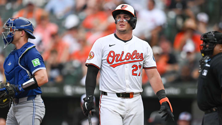 Jul 31, 2024; Baltimore, Maryland, USA; Baltimore Orioles catcher James McCann (27) looks on during the eighth inning against the Toronto Blue Jays at Oriole Park at Camden Yards. 