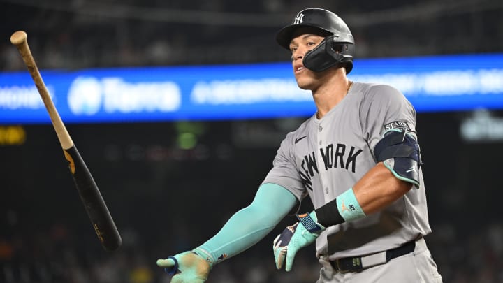 Aug 28, 2024; Washington, District of Columbia, USA; New York Yankees center fielder Aaron Judge (99) tosses his bat after drawing a walk against the Washington Nationals during the eighth inning at Nationals Park. Mandatory Credit: Rafael Suanes-USA TODAY Sports