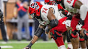 Sep 11, 2025; Winston-Salem, North Carolina, USA;  North Carolina State Wolfpack offensive lineman Jalen Grant (74) snaps the ball against against the Wake Forest Demon Deacons in second half at Allegacy Federal Credit Union Stadium. Mandatory Credit: Luke Jamroz-Imagn Images