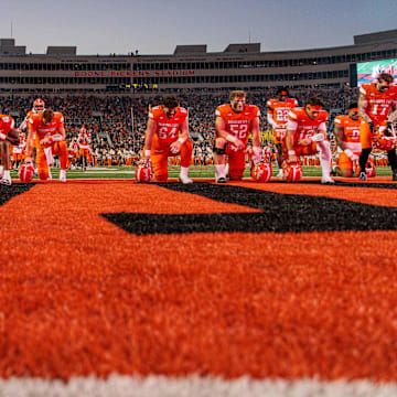 Oct 18, 2025; Stillwater, Oklahoma, USA; Oklahoma State Cowboys pray prior to the game against the Cincinnati Bearcats at Boone Pickens Stadium. Mandatory Credit: William Purnell-Imagn Images