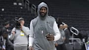 Milwaukee Bucks forward Bobby Portis walks onto the court to play the Minnesota Timberwolves.
