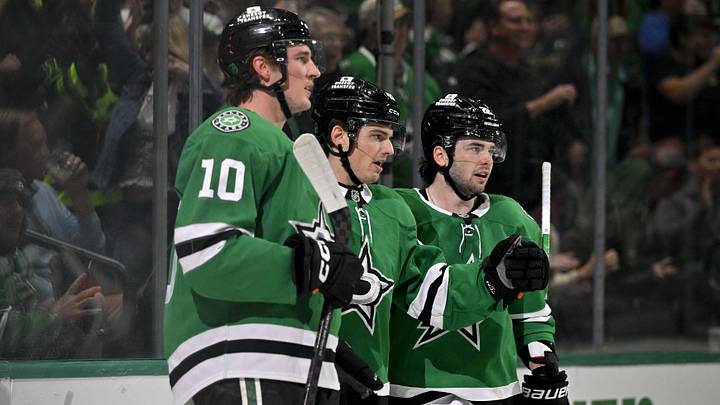 Apr 7, 2026; Dallas, Texas, USA; Dallas Stars center Oskar Back (10) and center Justin Hryckowian (49) and center Mavrik Bourque (22) celebrates a goal scored by Hryckowian against the Calgary Flames during the second period at the American Airlines Center. Apr 7, 2026; Dallas, Texas, USA; Dallas Stars center Oskar Back (10) and center Justin Hryckowian (49) and center Mavrik Bourque (22) celebrates a goal scored by Hryckowian against the Calgary Flames during the second period at the American Airlines Center.
