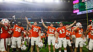 Sep 27, 2024; Miami Gardens, Florida, USA;  Miami Hurricanes players celebrate after the game against the Virginia Tech Hokies at Hard Rock Stadium. Mandatory Credit: Sam Navarro-Imagn Images