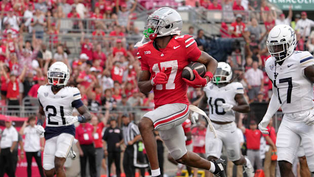 Ohio State Buckeyes wide receiver Carnell Tate (17) runs for a touchdown during the second half of Saturday’s NCAA Division I