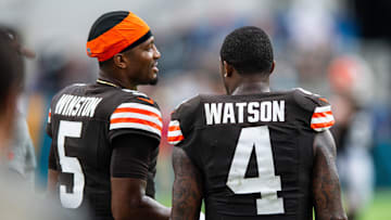Sep 15, 2024; Jacksonville, Florida, USA; Cleveland Browns quarterback Jameis Winston (5) talks with quarterback Deshaun Watson (4) in the fourth quarter at EverBank Stadium. Mandatory Credit: Jeremy Reper-Imagn Images