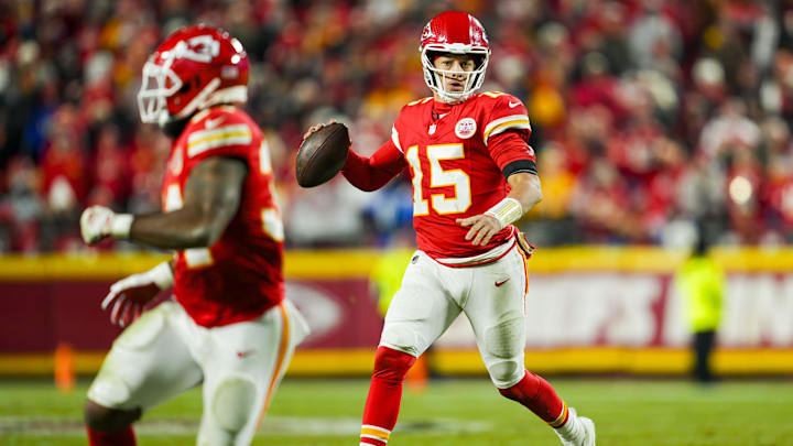 Dec 8, 2024; Kansas City, Missouri, USA; Kansas City Chiefs quarterback Patrick Mahomes (15) rolls out to pass during the second half against the Los Angeles Chargers at GEHA Field at Arrowhead Stadium. Mandatory Credit: Jay Biggerstaff-Imagn Images