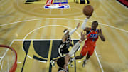 Dec 17, 2024; Las Vegas, Nevada, USA; Oklahoma City Thunder forward Jalen Williams (8) shoots against Milwaukee Bucks guard Gary Trent Jr. (5) during the Emirates NBA Cup championship game at T-Mobile Arena. Mandatory Credit: Kyle Terada-Imagn Images