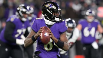 Jan 20, 2024; Baltimore, MD, USA; Baltimore Ravens quarterback Lamar Jackson (8) rolls out to throw against the Houston Texans during the second quarter of a 2024 AFC divisional round game at M&T Bank Stadium. Mandatory Credit: Mitch Stringer-USA TODAY Sports