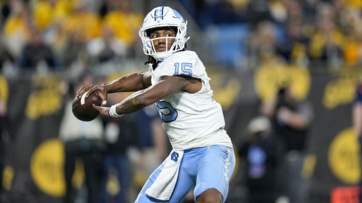 Dec 27, 2023; Charlotte, NC, USA; North Carolina Tar Heels quarterback Conner Harrell (15) throws the ball during the second half against the West Virginia Mountaineers at Bank of America Stadium. Mandatory Credit: Jim Dedmon-USA TODAY Sports