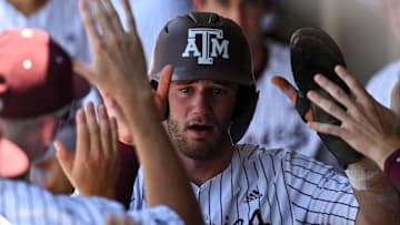 Jun 8, 2024; College Station, TX, USA; Texas A&M utility Gavin Grahovac (9) receives high fives in the dugout during the first inning against the Oregon at Olsen Field, Blue Bell Park Mandatory Credit: Maria Lysaker-USA TODAY Sports
