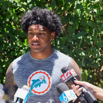Jun 4, 2024; Miami Gardens, FL, USA; Miami Dolphins quarterback Tua Tagovailoa (1) speaks to reporters during mandatory minicamp at Baptist Health Training Complex.