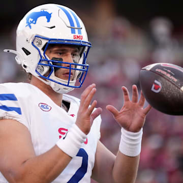 Oct 19, 2024; Stanford, California, USA; Southern Methodist Mustangs quarterback Preston Stone (2) warms up during the first quarter against the Stanford Cardinal at Stanford Stadium. Mandatory Credit: Darren Yamashita-Imagn Images