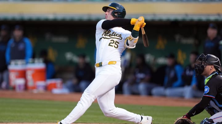 May 3, 2024; Oakland, California, USA; Oakland Athletics designated hitter Brent Rooker (25) hits a home run against the Miami Marlins during the fourth inning at Oakland-Alameda County Coliseum. Mandatory Credit: Darren Yamashita-USA TODAY Sports