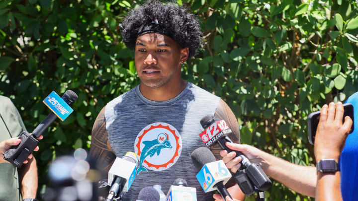 Miami Dolphins quarterback Tua Tagovailoa (1) speaks to reporters during mandatory minicamp at the Baptist Health Training Complex. 