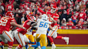 Kansas City Chiefs quarterback Patrick Mahomes passes as Los Angeles Chargers defender Morgan Fox rushes during an NFL game