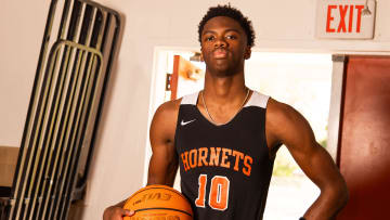 Hawthorne High School’s CJ Ingram is this year’s Gainesville Sun Boys Basketball Player of the Year. Ingram, 16 and a junior, plays point guard for the Hornets. He re-created this photo similar when his father was chosen as basketball player of the year by the Gainesville Sun years an ago. Ingram scored close to 500 points this year for the Hornets. He posed for portraits at the school Thursday afternoon, April 11, 2024. [Doug Engle/Ocala Star Banner]2024