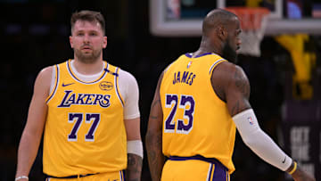 Feb 10, 2025; Los Angeles, California, USA; Los Angeles Lakers guard Luka Doncic (77) and forward LeBron James (23) on the court in the first half against the Utah Jazz at Crypto.com Arena. Mandatory Credit: Jayne Kamin-Oncea-Imagn Images