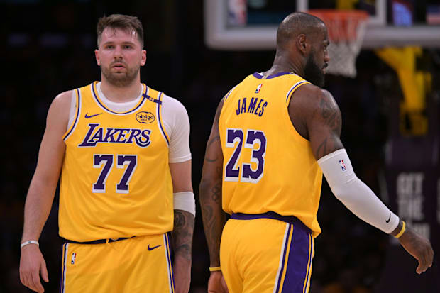 Los Angeles Lakers guard Luka Doncic (77) and forward LeBron James (23)