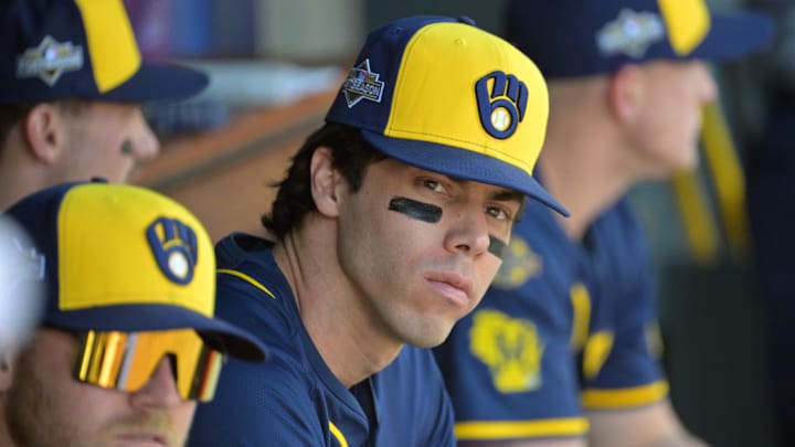 Brewers outfielder Christian Yelich looks on from the dugout before Game 3 against the Dodgers in the NLCS. Brewers outfielder Christian Yelich looks on from the dugout before Game 3 against the Dodgers in the NLCS.