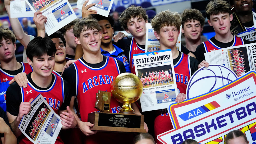 Arcadia guard Mason Kendrick (5) holds the trophy with his teammates after they beat Deer Valley in the 4A boys state championship game at Arizona Veterans Memorial Coliseum in Phoenix on March 5, 2026.