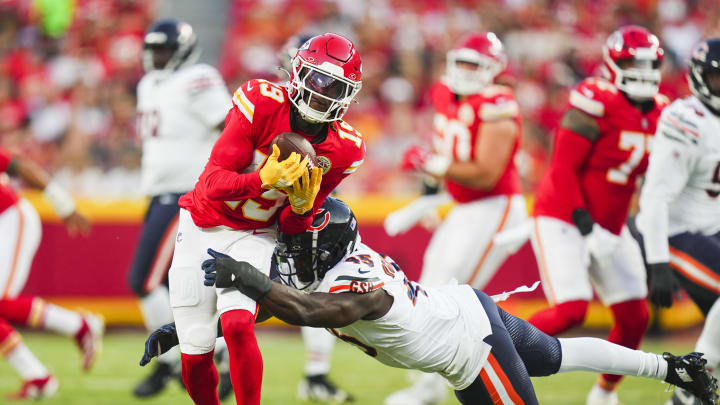 Aug 22, 2024; Kansas City, Missouri, USA; Kansas City Chiefs wide receiver Kadarius Toney (19) is tackled by Chicago Bears linebacker Amen Ogbongbemiga (45) at GEHA Field at Arrowhead Stadium. Mandatory Credit: Jay Biggerstaff-USA TODAY Sports