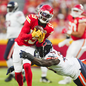 Aug 22, 2024; Kansas City, Missouri, USA; Kansas City Chiefs wide receiver Kadarius Toney (19) is tackled by Chicago Bears linebacker Amen Ogbongbemiga (45) at GEHA Field at Arrowhead Stadium.  