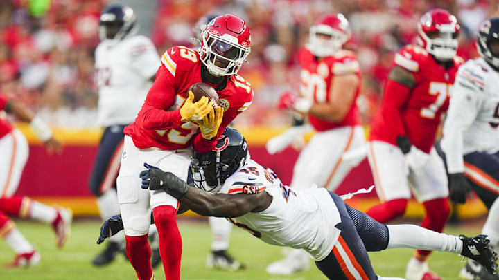 Aug 22, 2024; Kansas City, Missouri, USA; Kansas City Chiefs wide receiver Kadarius Toney (19) is tackled by Chicago Bears linebacker Amen Ogbongbemiga (45) at GEHA Field at Arrowhead Stadium.  