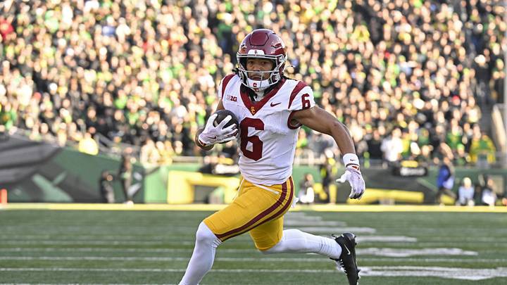 Nov 22, 2025; Eugene, Oregon, USA; Southern California Trojans wide receiver Makai Lemon (6) runs with the ball during the first half against the Oregon Ducks at Autzen Stadium. Mandatory Credit: Troy Wayrynen-Imagn Images