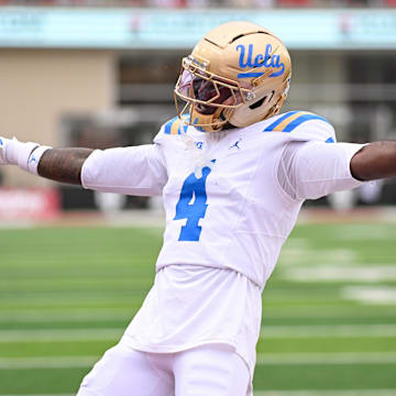 Oct 25, 2025; Bloomington, Indiana, USA; UCLA Bruins defensive back Key Lawrence (4) celebrates after a play during the first half against the Indiana Hoosiers at Memorial Stadium. Mandatory Credit: Robert Goddin-Imagn Images