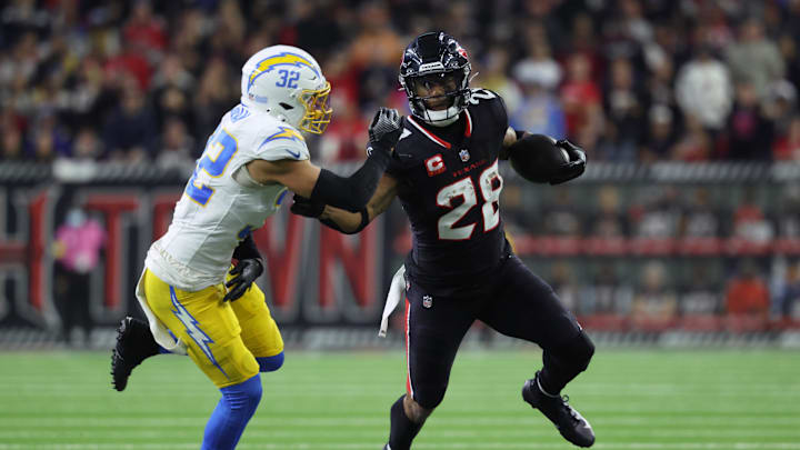 Joe Mixon stiff-arms Alohi Gilman during the Texans' game against the Chargers. Joe Mixon stiff-arms Alohi Gilman during the Texans' game against the Chargers.