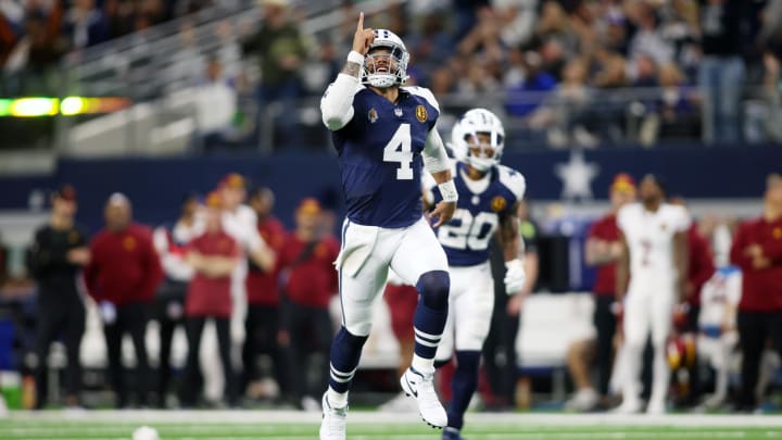 Nov 23, 2023; Arlington, Texas, USA; Dallas Cowboys quarterback Dak Prescott (4) celebrates throwing a touchdown in the fourth quarter against the Washington Commanders at AT&T Stadium. Mandatory Credit: Tim Heitman-USA TODAY Sports