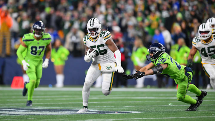 Green Bay Packers linebacker Edgerrin Cooper (56) runs back an interception against the Seattle Seahawks. Green Bay Packers linebacker Edgerrin Cooper (56) runs back an interception against the Seattle Seahawks.