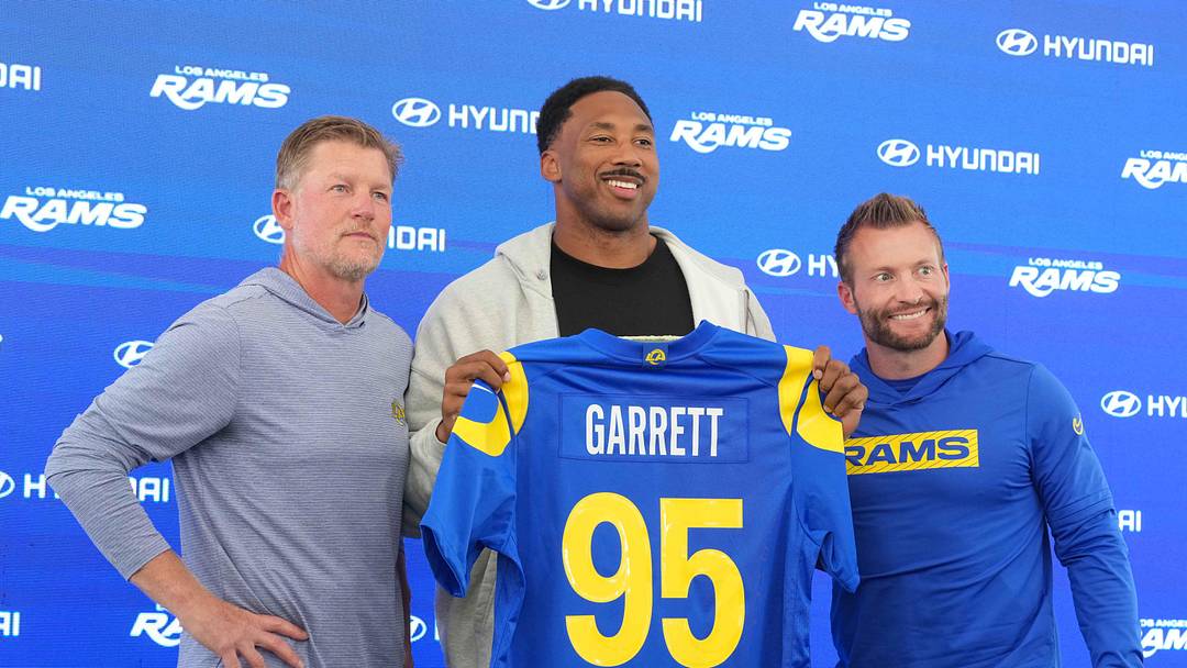 Jun 2, 2026; Woodland Hills, CA, USA; Los Angeles Rams defensive end Myles Garrett (95) poses with general manager Les Snead (left) and coach Sean McVay at press conference at Rams Practice Facility. Mandatory Credit: Kirby Lee-Imagn Images