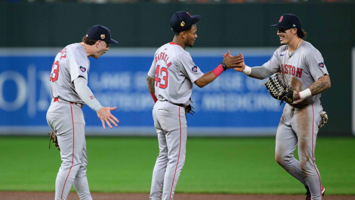 Aug 17, 2024; Baltimore, Maryland, USA; Boston Red Sox outfielder Jarren Duran (16), shortstop Ceddanne Rafaela (43) and first baseman Romy Gonzalez (23) celebrate after the game between the Baltimore Orioles and the Boston Red Sox at Oriole Park at Camden Yards. Mandatory Credit: Reggie Hildred-USA TODAY Sports