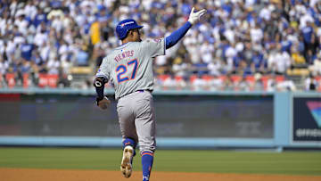 Oct 14, 2024; Los Angeles, California, USA; New York Mets third baseman Mark Vientos (27) runs after hitting a grand slam home run in the second inning against the Los Angeles Dodgers during game two of the NLCS for the 2024 MLB Playoffs at Dodger Stadium. Mandatory Credit: Jayne Kamin-Oncea-Imagn Images