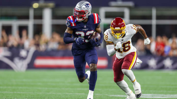 New England Patriots cornerback Joejuan Williams (33) runs back an interception against Washington