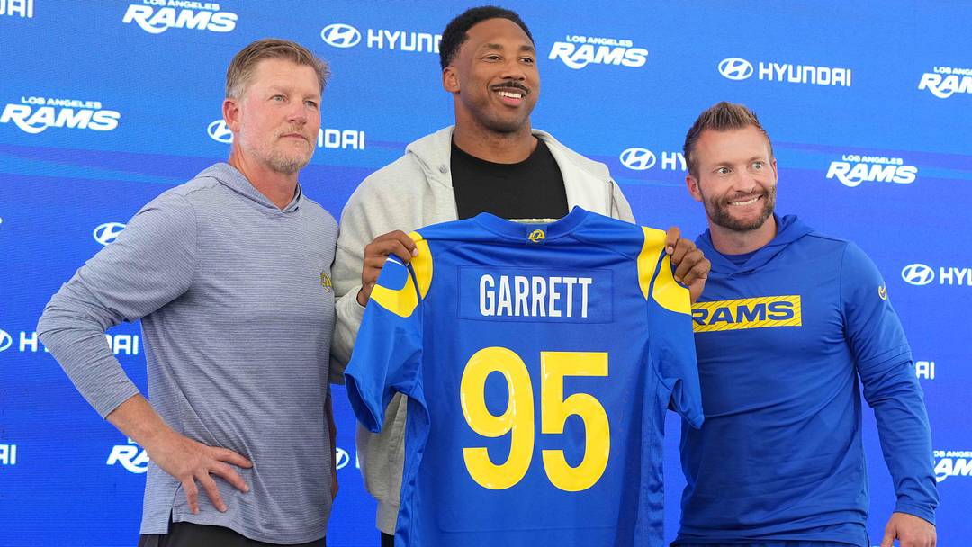 Jun 2, 2026; Woodland Hills, CA, USA; Los Angeles Rams defensive end Myles Garrett (95) poses with general manager Les Snead (left) and coach Sean McVay at press conference at Rams Practice Facility. Mandatory Credit: Kirby Lee-Imagn Images