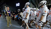 May 27, 2023; Philadelphia, PA, USA; Virginia Cavaliers head coach Lars Tiffany (L) prepares to lead his team out of the tunnel for a game against the Notre Dame Fighting Irish at Lincoln Financial. Mandatory Credit: Bill Streicher-Imagn Images