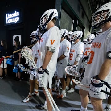 May 27, 2023; Philadelphia, PA, USA; Virginia Cavaliers head coach Lars Tiffany (L) prepares to lead his team out of the tunnel for a game against the Notre Dame Fighting Irish at Lincoln Financial. Mandatory Credit: Bill Streicher-Imagn Images
