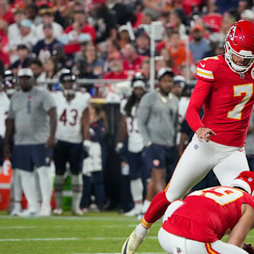 Aug 22, 2024; Kansas City, Missouri, USA; Kansas City Chiefs kicker Harrison Butker (7) kicks a point after touchdown against the Chicago Bears during the first half at GEHA Field at Arrowhead Stadium. Mandatory Credit: Denny Medley-Imagn Images