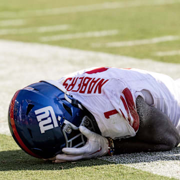 Sep 15, 2024; Landover, Maryland, USA; New York Giants wide receiver Malik Nabers (1) holds his face after dropping a pass against the Washington Commanders in the second half at Commanders Field.  