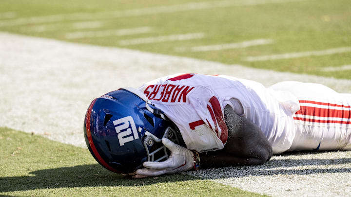 Sep 15, 2024; Landover, Maryland, USA; New York Giants wide receiver Malik Nabers (1) holds his face after dropping a pass against the Washington Commanders in the second half at Commanders Field.  