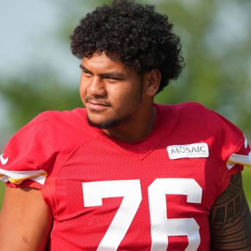 Jul 22, 2024; St. Joseph, MO, USA; Kansas City Chiefs offensive tackle Kingsley Suamataia (76) walks down the hill from the locker room to the fields prior to training camp at Missouri Western State University. Mandatory Credit: Denny Medley-USA TODAY Sports