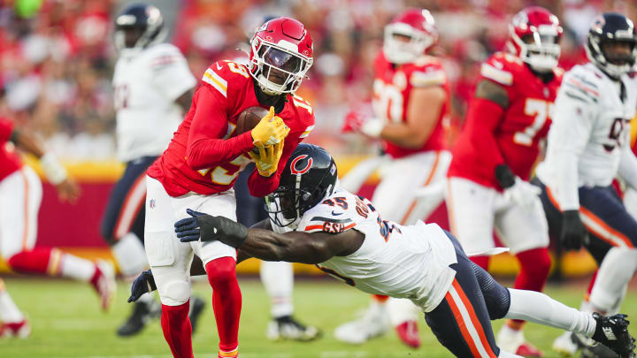 Aug 22, 2024; Kansas City, Missouri, USA; Kansas City Chiefs wide receiver Kadarius Toney (19) is tackled by Chicago Bears linebacker Amen Ogbongbemiga (45) at GEHA Field at Arrowhead Stadium. Mandatory Credit: Jay Biggerstaff-USA TODAY Sports