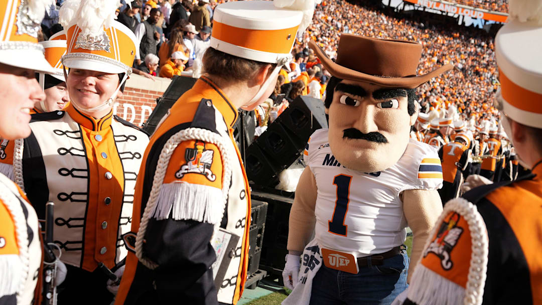Nov 23, 2024; Knoxville, Tennessee, USA; UTEP Miners mascot Paydirt Pete meets with members of the Pride of the Southland band during a game between the Tennessee Volunteers and UTEP Miners at Neyland Stadium. Mandatory Credit: Saul Young/USA TODAY Network via Imagn Images