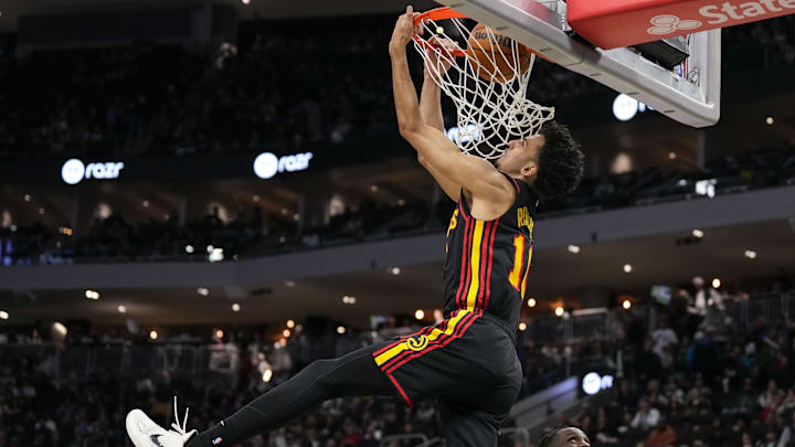 Zaccharie Risacher #10 of the Atlanta Hawks dunks the ball against the Milwaukee Bucks.