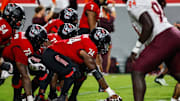 Sep 27, 2025; Raleigh, North Carolina, USA;  North Carolina State Wolfpack offensive lineman Jalen Grant (74) with the ball during the first half of the game against Virginia Tech Hokies at Carter-Finley Stadium. Mandatory Credit: Jaylynn Nash-Imagn Images